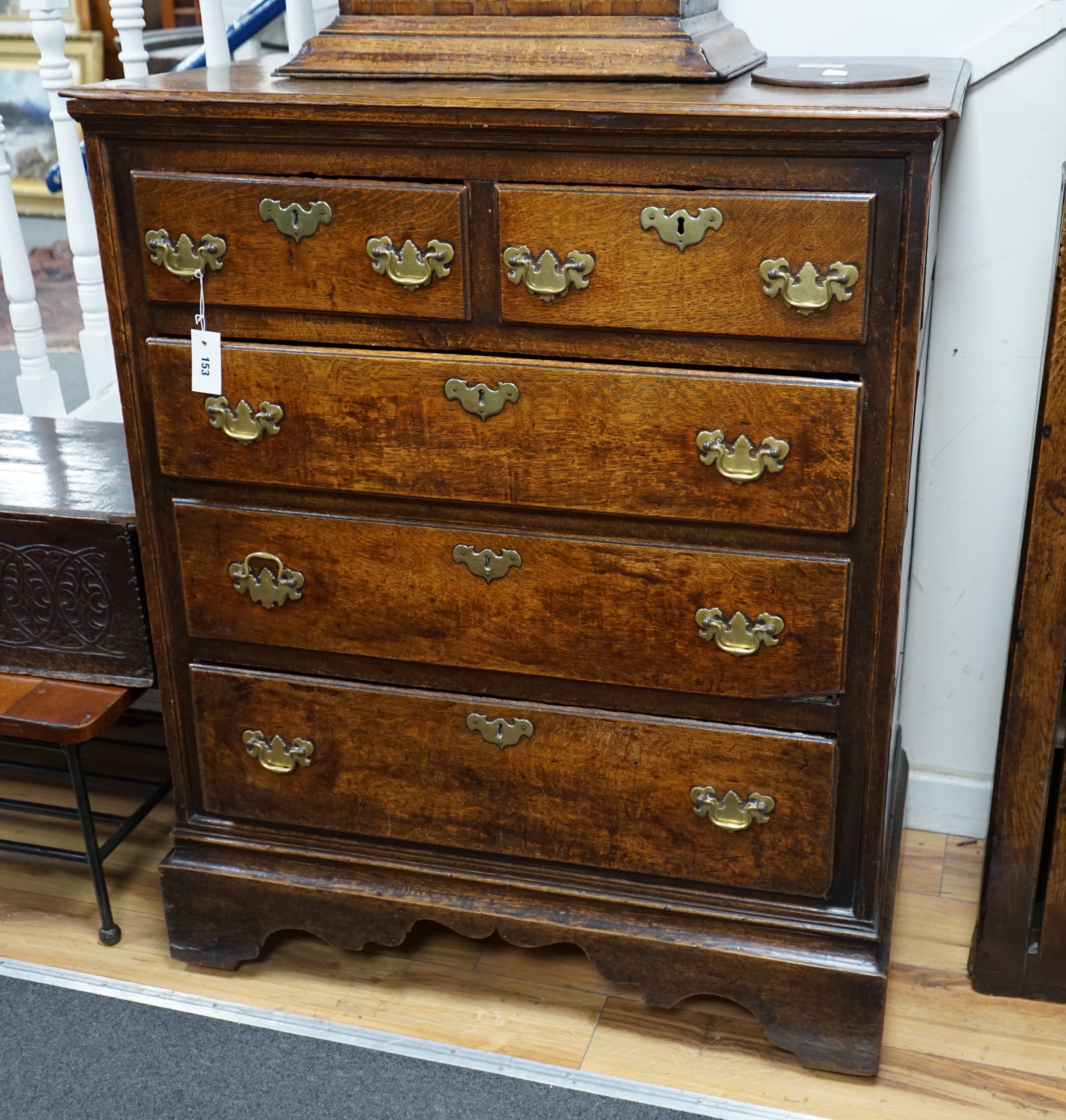 Am 18th century oak chest of two short and three long drawers fitted with brass handles, width 94cm depth 51cm height 114cm